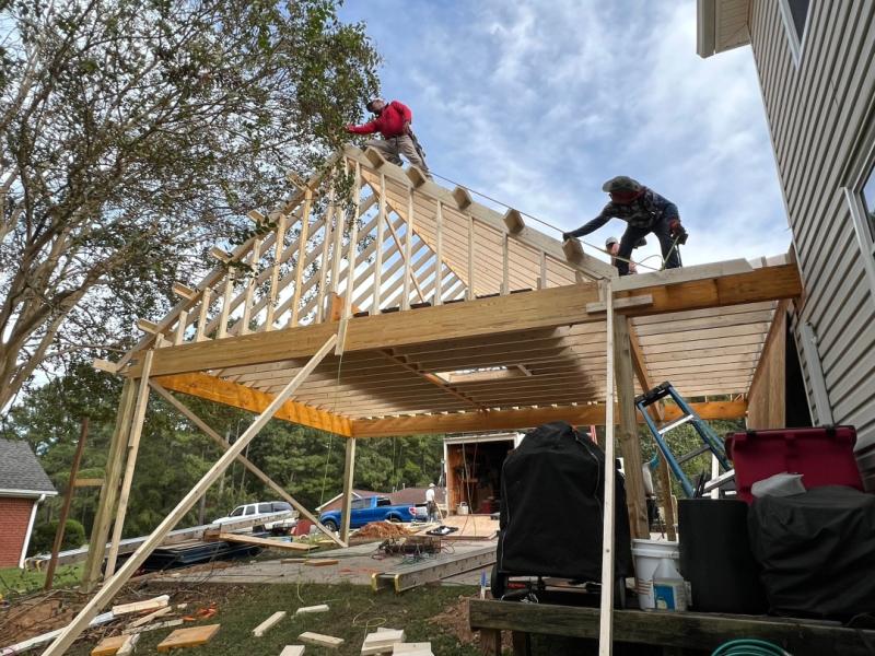 Impact Roofing & Construction builds an attached carport on an Augusta GA home.