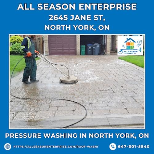Pressure Washing in North York, ON - All Season Enterprise. An All Season Enterprise employee expertly pressure washes a paver driveway in North York, ON. The worker, wearing safety gear, uses professional-grade equipment to remove dirt and grime, restori