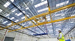 Hinged, multi-span cranes are unusual but essential in aircraft production where wide bays are common.