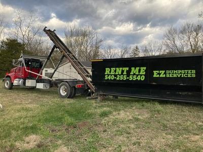 Streamline your waste disposal with EZ Dumpster Services, Staunton's go-to dumpster rental company. This visual showcases our heavy-duty equipment ready to deliver a driveway-friendly roll-off container straight to your project site. We specialize in rel