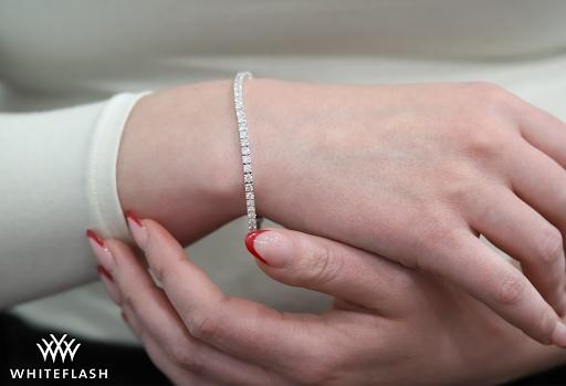 A diamond tennis bracelet, showcasing the refined construction, elegant fit, and matched Hearts & Arrows melee that define Whiteflash's approach to this timeless jewelry staple.