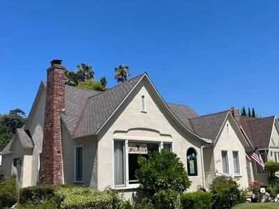 A beautifully restored residential roof by Modern Roofing Inc., featuring clean lines and expert craftsmanship that enhance the home's curb appeal and long-term protection.