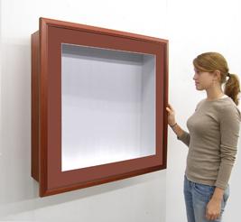 SwingFrame Shadowbox Display Case with wood frame, white interior and 12 inch depth