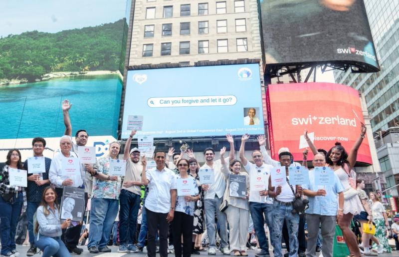 Sadhu Vaswani Center Of World Peace team, committee members, Dada J.P. Vaswani's followers from New York and New Jersey gather under the Times Square billboard lit in his honour.