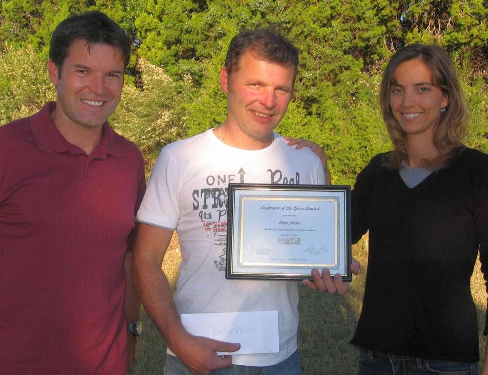 BONVU.COM founder Klaus Ruhmer (left) and CEO Regina Ruhmer (right) honoring Customer of the Year Dieter Hoeller in Austin, TX.