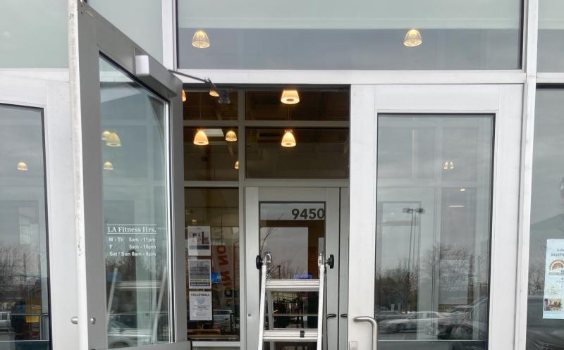 MacArthur Locks & Doors providing expert locksmith services at a D.C. fitness center.