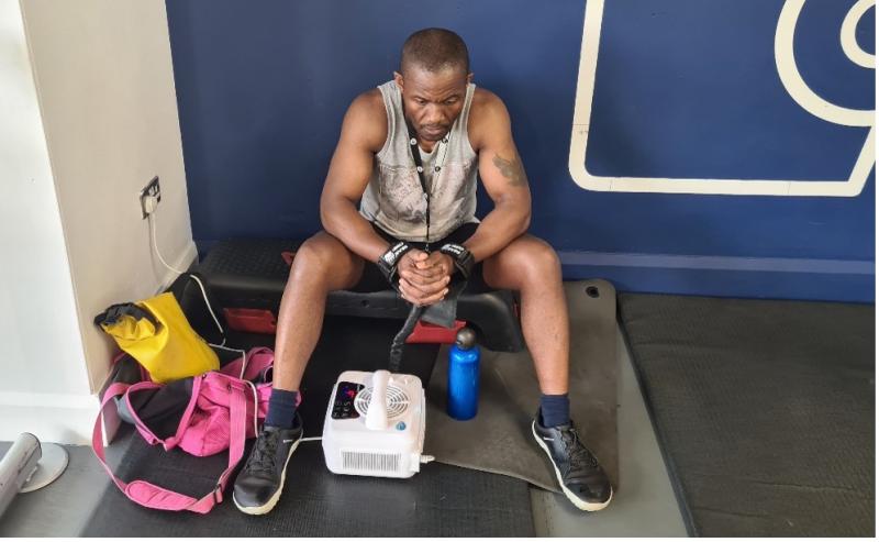 Idai Makaya uses the CoreTx Palm Cooling device during a training session prior to world record attempt.