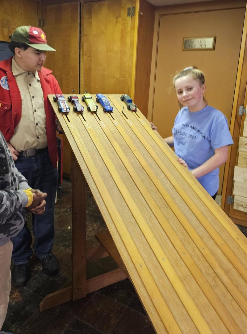 Delia, a Troop 1841 Scout who first started her scouting adventures in Bright Futures, enjoys a Pinewood Derby event.
