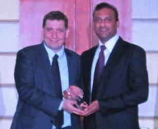 Olivier Delepine, Vice-President UAE & Gulf Countries, Schneider Electric (left) presenting the award to Prashant Naik
