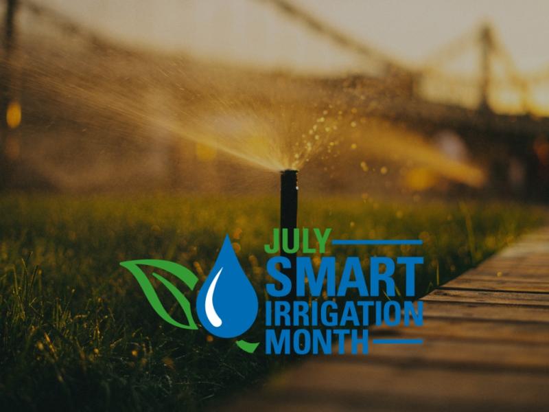 Sprinkler watering a green lawn at sunset with Smart Irrigation Month logo promoting efficient water conservation during July.