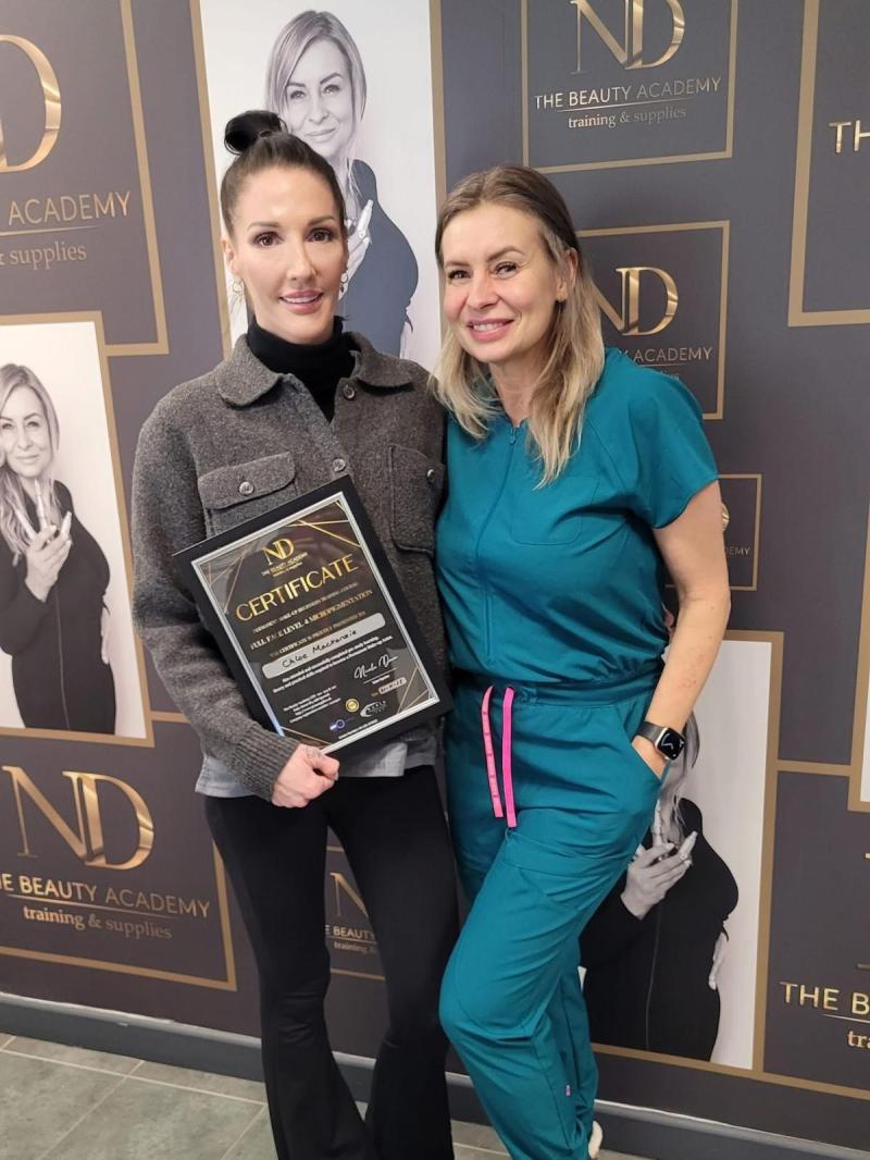 Chloe Mackenzie receiving her certificate of qualification for PMU