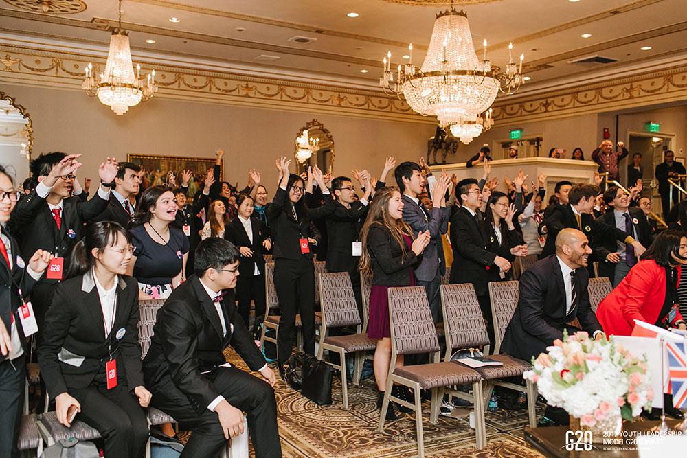 Students celebrate during the 2017 Model G20 Youth Leadership Summit
