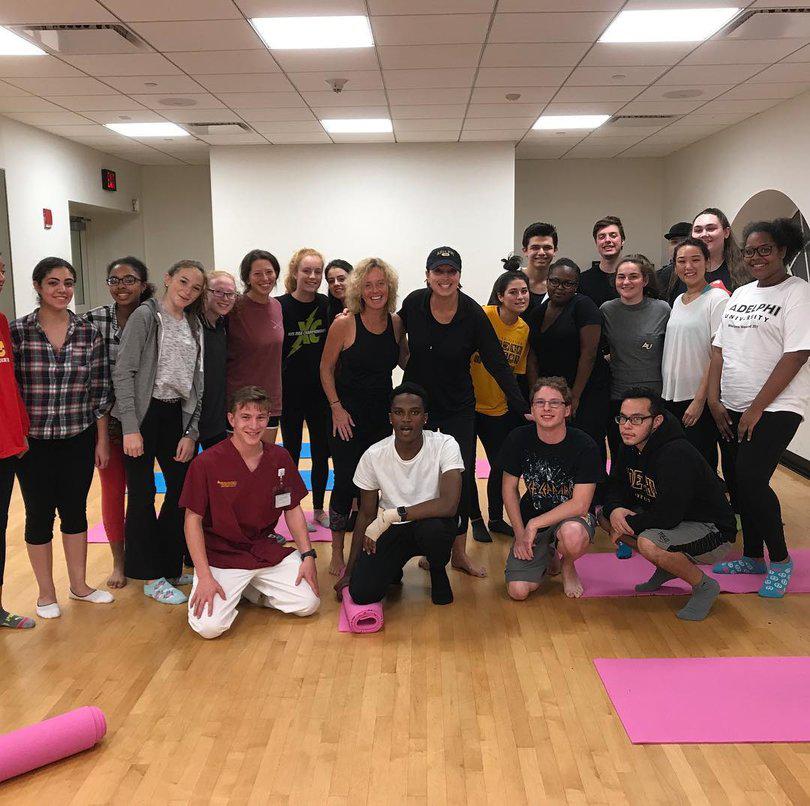 Members of the First-Year Living-Community posing after yoga.