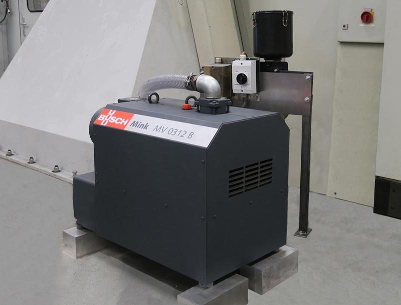 Mink claw vacuum pump for generating retaining vacuum on one of the three CNC portal milling machines