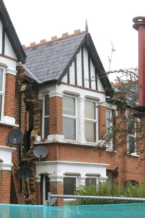 A crack appears between two houses after a rogue builder had been at work - the very thing Firm Choice seeks to prevent.
