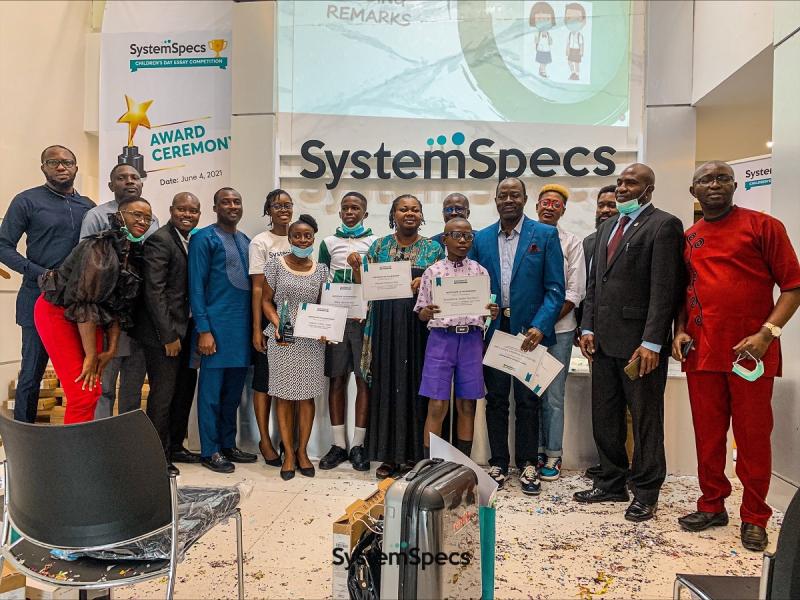 Cross section of winners, judges, parents, teachers and company representatives at the award ceremony for the Systemspecs CDEC