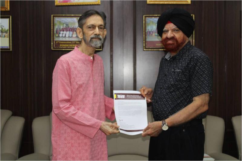 The Vice Chancellor of Pondicherry University facilitating Prof S.A. Abbasi on getting the Kletz Merit Award