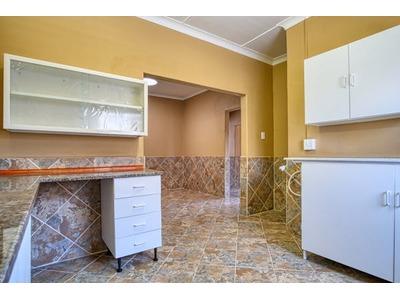 A newly remodeled kitchen featuring fresh paint, updated cabinetry, and modern countertops, showcasing a clean and functional design in a bright and spacious area.