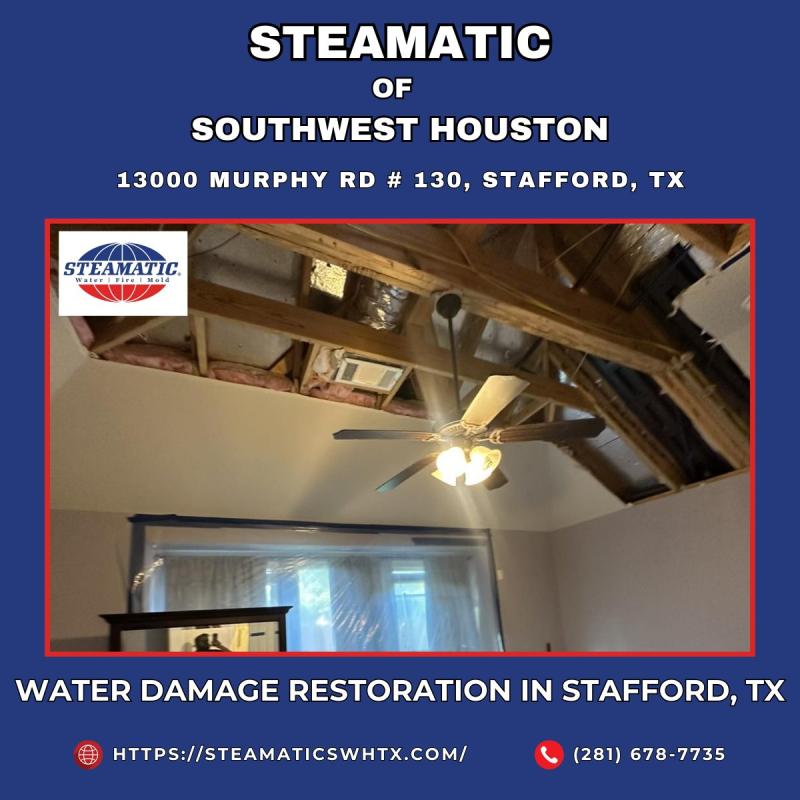 Water Damage Restoration in Stafford, TX - Steamatic of Southwest Houston. The image shows a ceiling with severe water damage that has been remediated by removing the affected drywall. High-powered fans and dehumidifiers are in place, working together to