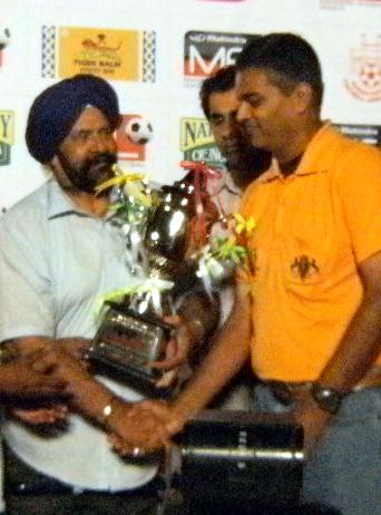 PIFA coach & Director receiving the runners up trophy