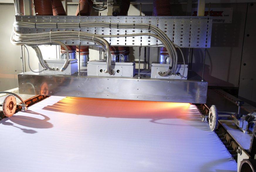 Carbon infrared emitters from Heraeus Noblelight help to achieve faster drying of fabrics for outdoor clothing and increase production speed.