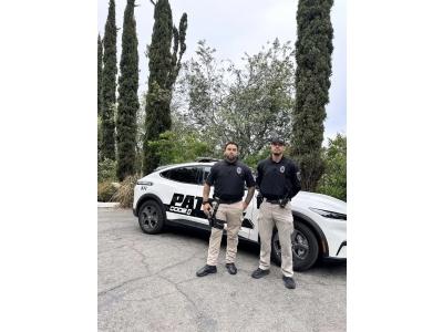 The image features two uniformed security guards standing in front of a company vehicle, illustrating the professional presence of CODE 4 PRIVATE SECURITY.