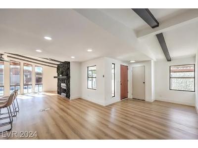The photo shows the bright, renovated interior of a residential home, a type of property often bought or sold with the help of a real estate team like the Sandra Flores Group.