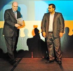 Mr. Khaldoun Abdo (l) from Blue Coat Systems receving the award from Mr. Sajid Sarwar from Almasa IT Distribution